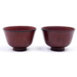 A pair of Chinese lacquered and varnished wood bowls, 20th c, 11cm diam Surface wear in places