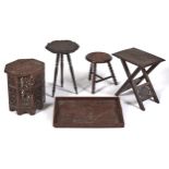 Three Indian carved hardwood tripod and coffee tables, including a folding table, early 20th c and a