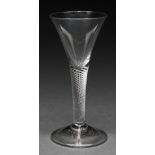 An English wine glass, mid 18th c, the drawn trumpet bowl on multi series air twist stem, folded