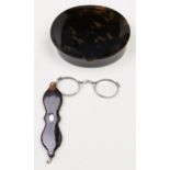A silver and tortoiseshell lorgnette, 19th c, 10.5cm and a silver gilt mounted oval tortoiseshell