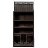 A Victorian oak 'Indian' bookcase in the manner of Liberty & Co, c1885, with swept top, 160cm h;