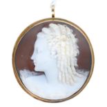 A cameo brooch pendant, early 20th c, carved with the head of a girl in profile, gold mount, 40mm