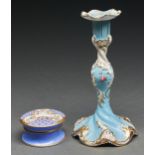 A English porcelain candlestick and nozzle, c1830, painted with flowers on a turquoise ground,