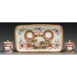 A Meissen inkstand, late 19th century, the tray, covered inkwell and pounce pot painted in early