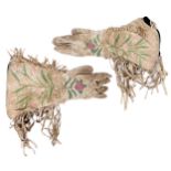 A pair of native American suede and embroidered and deeply fringed gauntlets, first half 20th c,