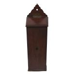 A Victorian mahogany wall hanging candle box, with shaped back plate, the sloping lid with flush