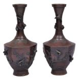 A pair of Japanese bronze vases, Meiji period, the body of hexagonal section, carved and applied