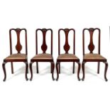 A set of four mahogany dining chairs, early 20th c, the splat carved with a shell, having slip seat,