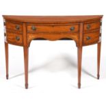 An Edwardian semi elliptical satinwood, rosewood, inlaid and penwork sideboard, the fan fluted top