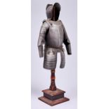 Armour. A tinplate model almain rivet, in early 16th c German style, wood stand, 43cm h A decorative