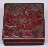 A Chinese cinnabar lacquer box and cover, late 19th c, the cover carved with two boys seated beneath