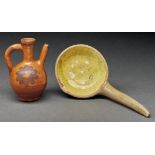 A  lead glazed earthenware ladle, 19th c, with yellow slip bowl 26cm l and a  lead glazed spouted