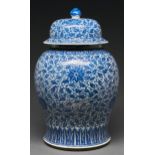 A Chinese blue and white jar and cover, Qing dynasty, 19th c, painted with lotus meander between