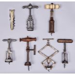 Six Victorian and other 19th century and early 20th century corkscrews, including a half bottle or