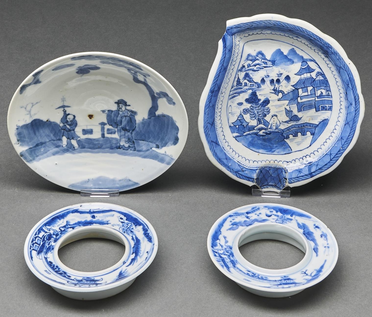 A Chinese blue and white dish painted with two figures beneath a pine tree, 18cm diam, a Chinese