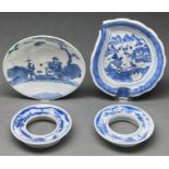 A Chinese blue and white dish painted with two figures beneath a pine tree, 18cm diam, a Chinese