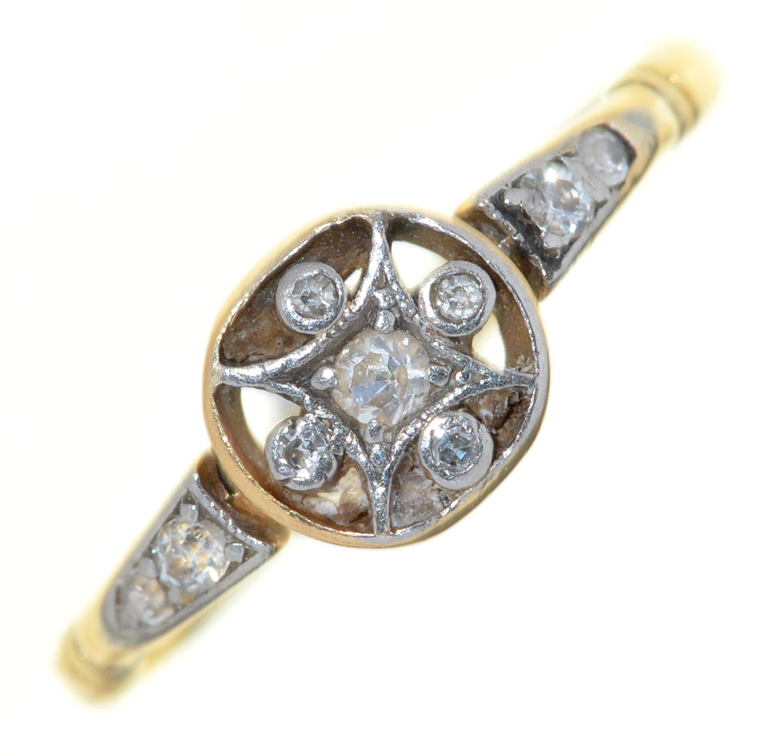 A diamond cluster ring, in gold marked 18ct, 2.7g, size P Worn