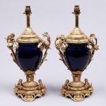 A pair of French giltmetal mounted blue glazed porcelain lamps, 20th c, in Louis XVI style, 37cm h