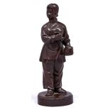 A Chinese carved wood statuette of a young woman holding a pot of tea, second half 20th c, 20cm h