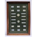 A frame of twenty-two Chinese export  mother of pearls gaming counters, 19th c, frame 30 x 44cm Good