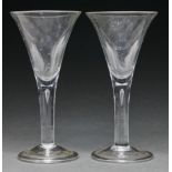 A pair of English wine glasses of unusually large size, 19th c, in mid 18th c style, the drawn