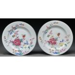 Two Chinese famille rose plates, 19th c, 23cm diam One with localised wear and small flat chip under