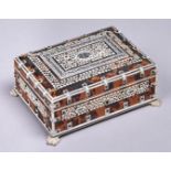 An Anglo Indian tortoiseshell, ivory and penwork jewel box, late 19th c, on carved ivory paw feet,