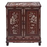 A Chinese mother of pearl inlaid hardwood table cabinet, early 20th c,  the fitted interior with two