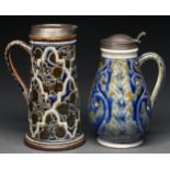 A silver mounted Doulton ware flagon and jug, 1875 and 1877, decorated by Ernest Jarratt and Edith D