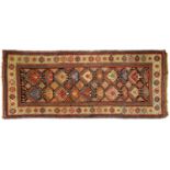 An antique Kazak runner, c1910, 115 x 255cm Fair - good condition