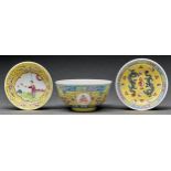 A Chinese yellow ground famille rose bowl and two saucers, bowl 11cm diam Good conditin