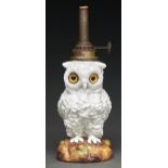 A Continental porcelain glass eyed owl oil lamp, late 19th c, 15cm h excluding brass fitment Good