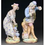 A pair of Vion and Baury polychrome biscuit porcelain figures of a gallant as a sportsman and a lady