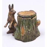 A cold painted spelter hare and tree-trunk novelty inkwell, early 20th c, 56mm h Lid re-attached,