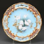 A Royal Worcester plate, 1906, painted by C H C Baldwyn, signed, with fan-tailed pigeons and