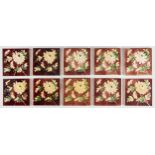 A set of ten late Victorian 6" majolica wall tiles, c1890, moulded with flowers and leafage on a
