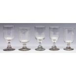 Thirty Victorian glass goblets, each of similar form, on short, solid or faceted stem and plain