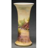 A Royal Worcester spill vase, 1928, printed and painted with a thatched cottage, signed R Rushton,