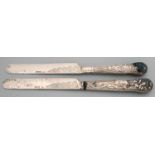 A George V silver table knife, Stag Hunt pattern and a George V desert knife, Bacchanalian pattern,