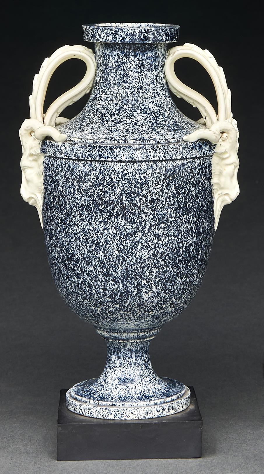 A Wedgwood variegated vase, c1770, of Queen's ware, shield shaped with ram's head handles, the