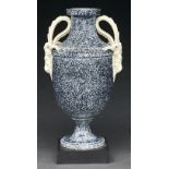 A Wedgwood variegated vase, c1770, of Queen's ware, shield shaped with ram's head handles, the