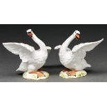 A pair of French porcelain models of swans, 19th / early 20th c, after Meissen originals, 16cm h,