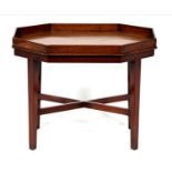 An octagonal mahogany tray top table, part 19th c,  on later affixed stand, 44cm h; 39 x 55cm The