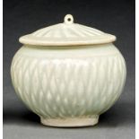 A Chinese carved Qingbai jarlet and cover, Song dynasty, of typical ovoid form and slightly domed