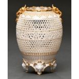 A Royal Worcester reticulated vase by George Owen, 1912, ovoid with gilt grotesque mask-and-ring