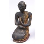 A Tibetan giltwood figure of a monk, 45cm h Small losses, chipped around the base, gilding and
