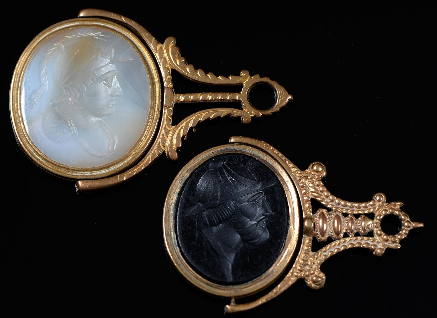 Two George III giltmetal fob seals, with chalcedony or basalt (?) intaglio, 42 and 51mm Light wear