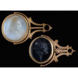 Two George III giltmetal fob seals, with chalcedony or basalt (?) intaglio, 42 and 51mm Light wear