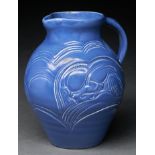 A Susie Cooper blue glazed earthenware Ram and Deer jug, c1936, 21cm h, incised Susie Cooper England