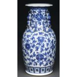 A Chinese blue and white vase, Canton, 19th c, painted in the manner of 'heaping and piling' with